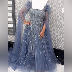 Blue cape sleeves evening gown with feathers